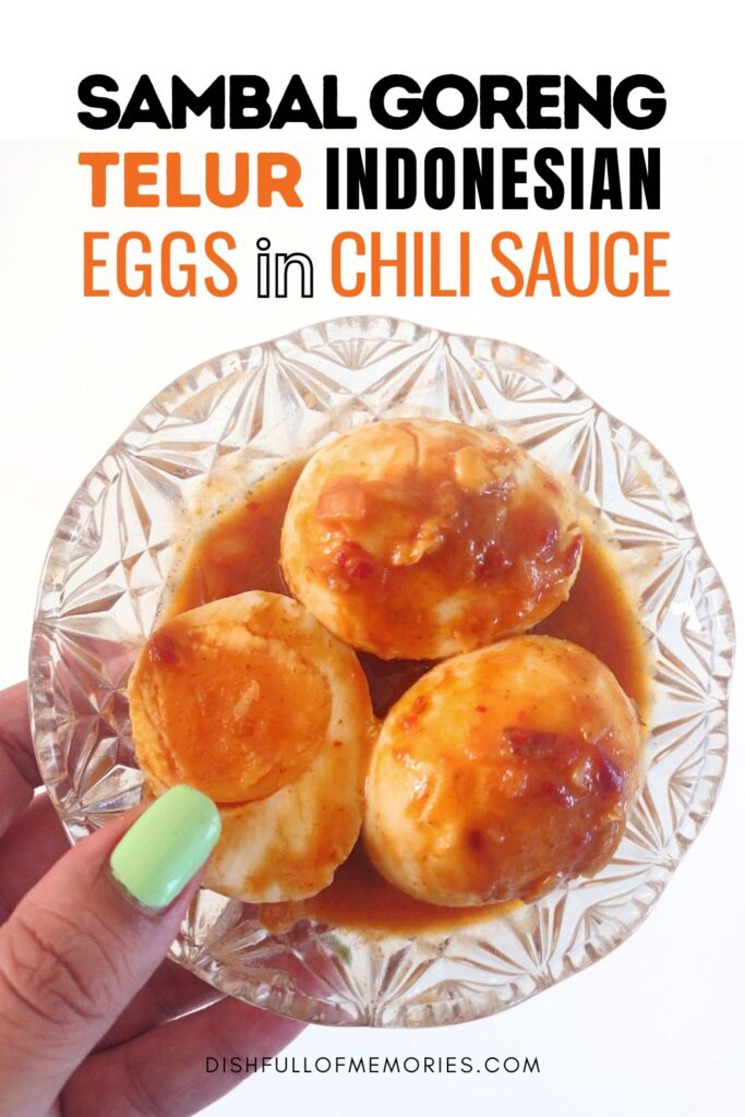 Hand holding up a bowl with boiled eggs in a spicy sauce. Text on image: Samal Goreng Telur. indonesian eggs in chili sauce. Dish full of memories dot com.