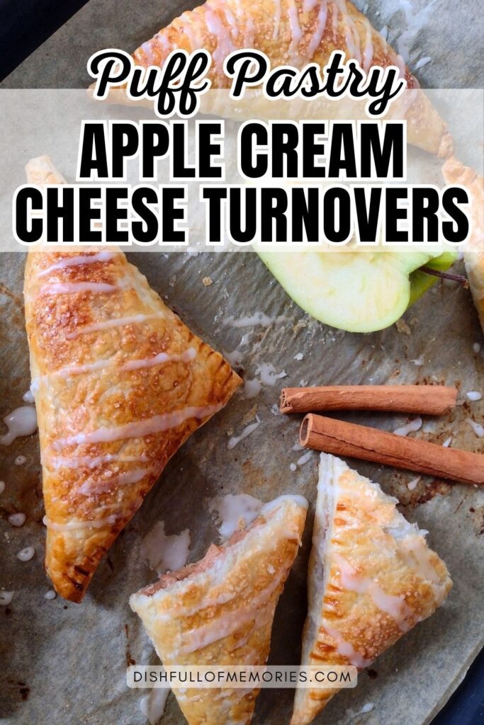 Turnovers with frosting on baking sheet with cinnamon sticks and apple. Text on image: Puff pastry apple cream cheese turnovers. Dish full of memories dot com.