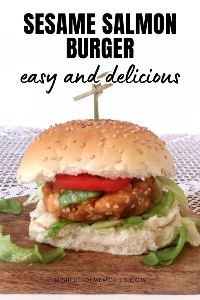 Homemade fresh salmon burger on wood serving plate. Text on image: Sesame salmon burger. Easy and delicious. Dish full of memories dot com.