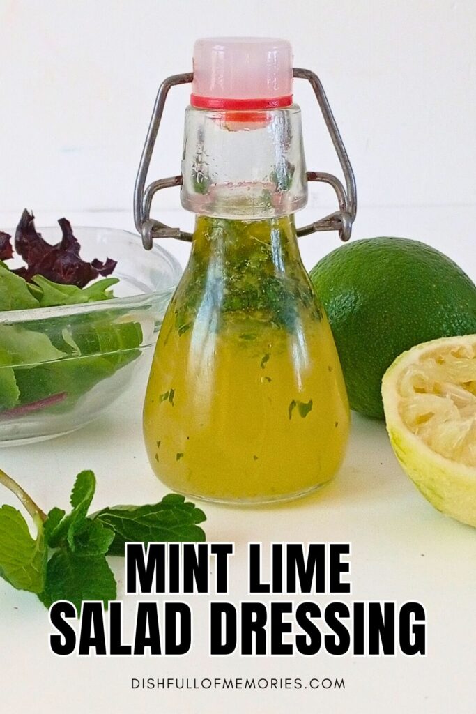 Wire jar filled with homemade vinaigrette. Lettuce, mint leaves and limes around it. Text on image: Mint lime salad dressing. Dish full of memories dot com.