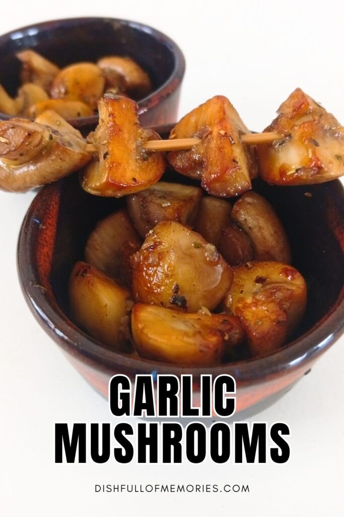 Two bowls full of mushrooms with a mushroom skewer on top. Text on image: Garlic Mushrooms. Dish full of memories dot com.