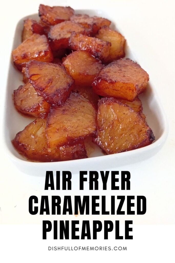 Dish full of pineapple chunks. Text on image: Air fryer caramelized pineapple. Dish full of memories dot com.