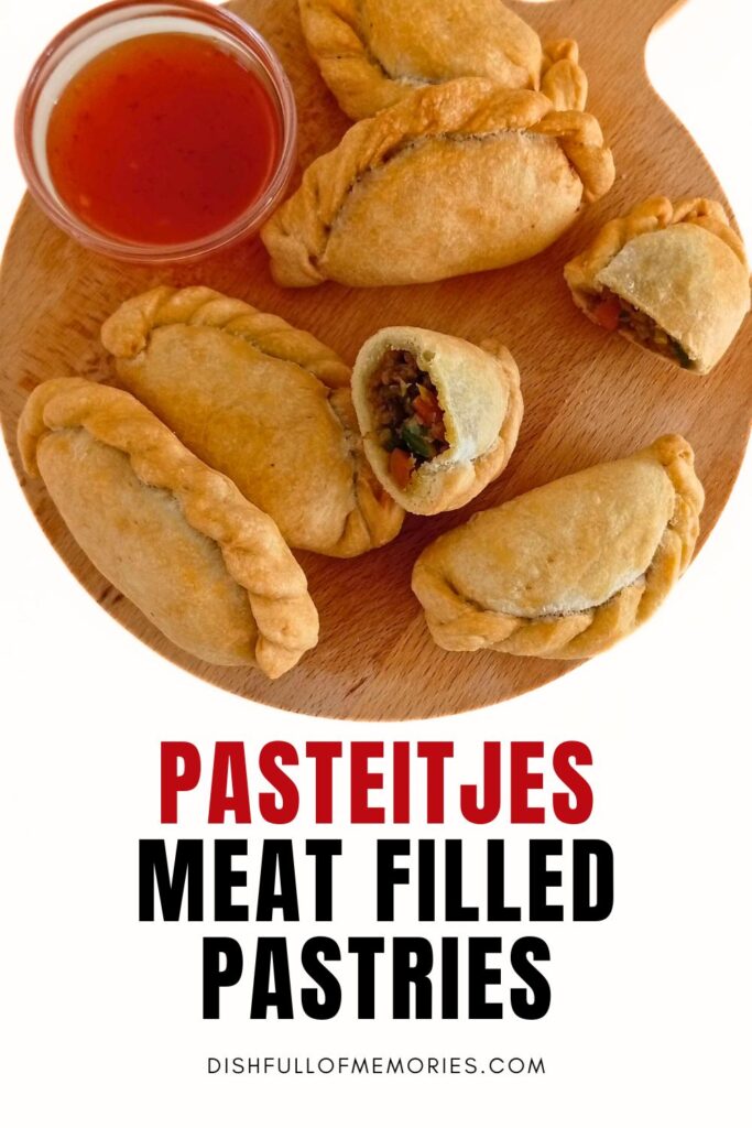 Indonesian hand pies on round cutting board with red dipping sauce. Text on image: Pasteitjes meat filled pastries. Dish full of memories dot com.