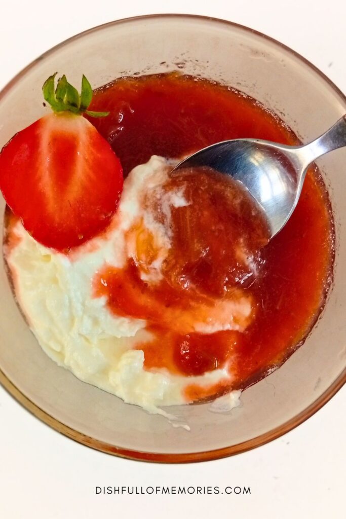 Bowl of yogurt and homemade strawberry rhubarb compote.