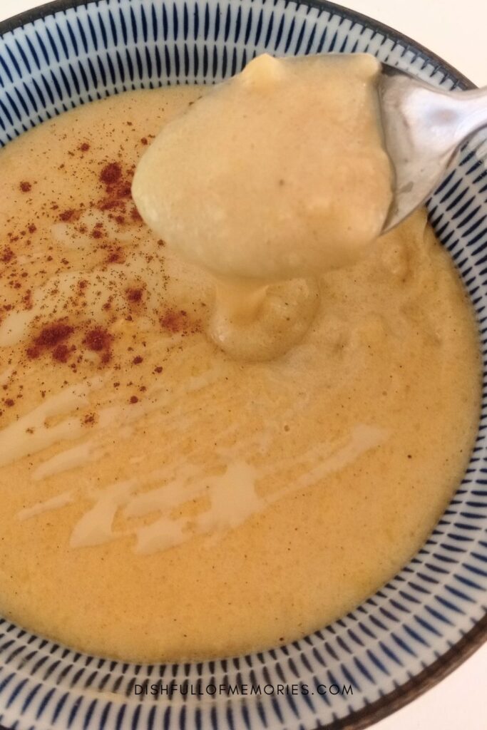 Close up of spoon and bowl full of homemade Jamaican porridge.