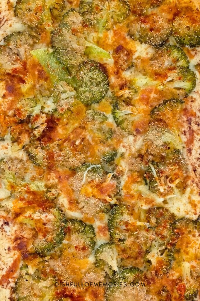Sheet pan full of crispy broccoli cheese chips.